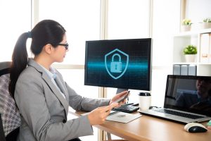 professional cyber security company worker using digital tablet checking online, to consider the problem of the password