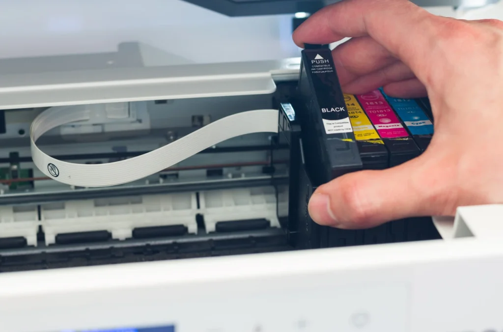 Printer ink cartridges being removed